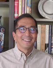 Headshot of author Alden M. Hayashi.